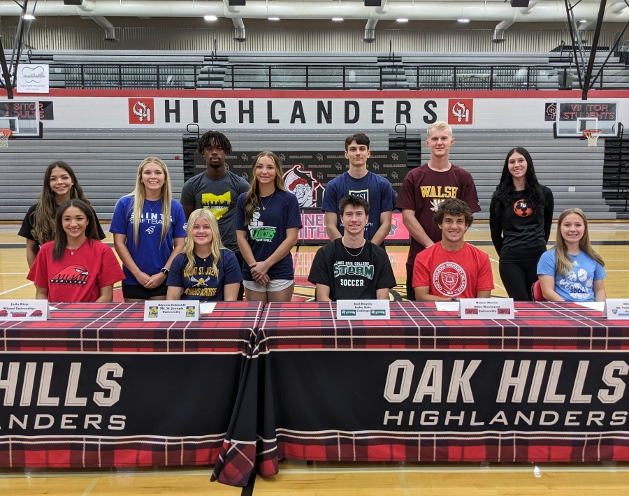 group shot of students signing for college